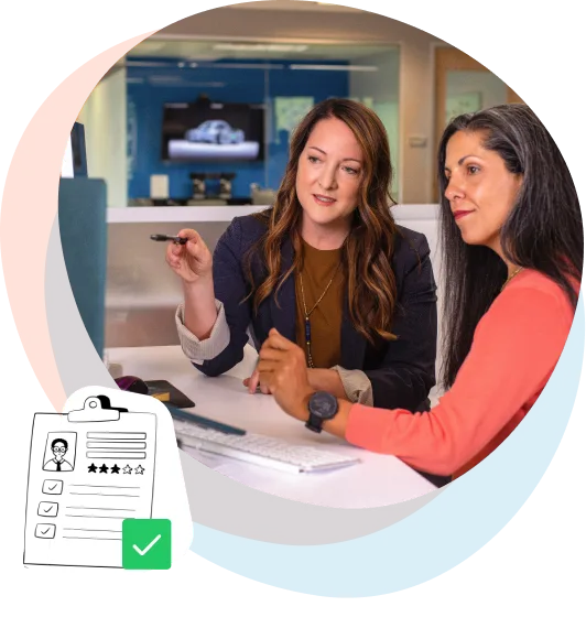 Woman explaining how it works to a co-worker